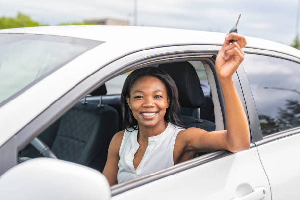 istock black woman driver seated in her new car 1322376864