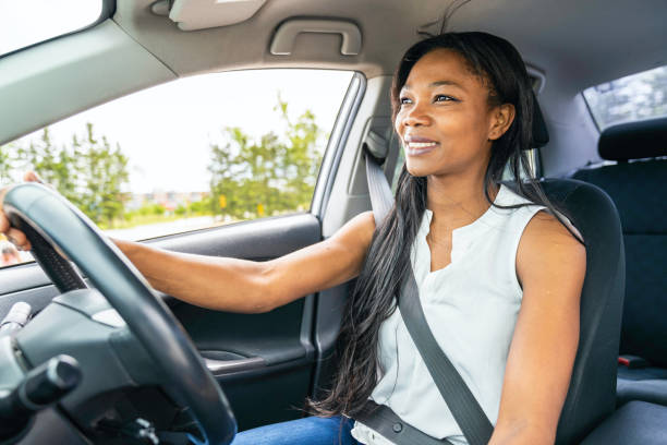 istock black woman driver seated in her new car 1322376873