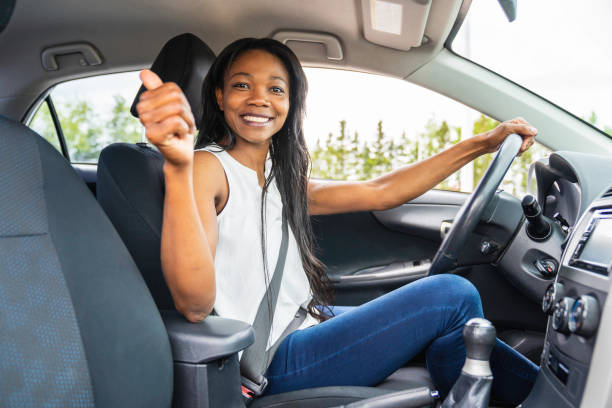 istock black woman driver seated in her new car 1322376892