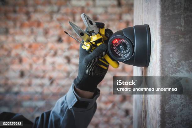 Security Camera Stock Photo - Download Image Now - Security Camera, Installing, Camera - Photographic Equipment