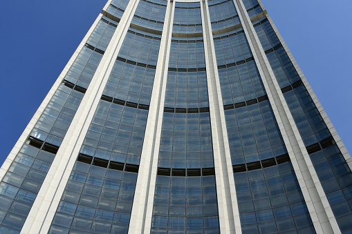 Vienna, Austria - July 27, 2023: UN headquarters building in the Austrian capital. The Vienna International Centre or UNO City with green lawn and blue sky in summer