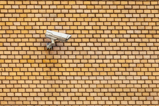 A security camera affixed to a wall.