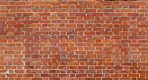 istock Texture of an old damaged brick wall 1322391003