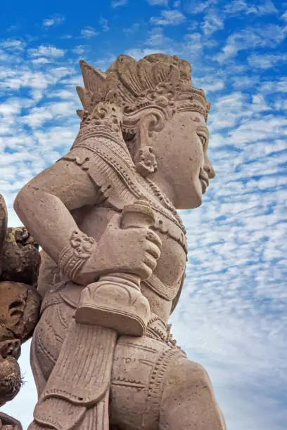 Photo of Image of a typical Balinese sculpture photographed against the blue sky