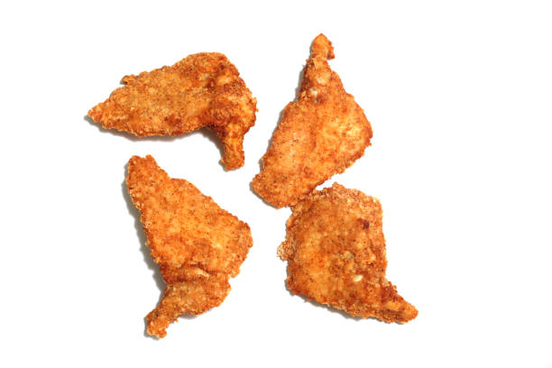 istock fried chicken thigh in a white background 1322391324
