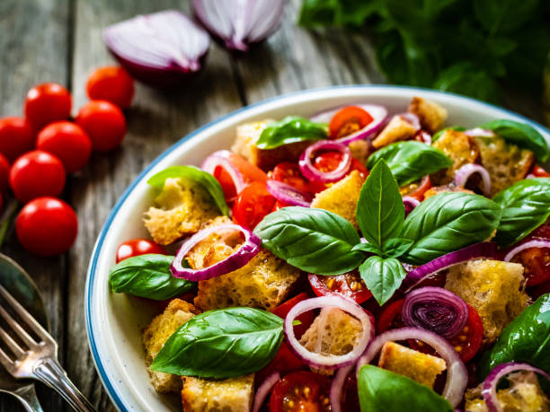 istock Classic panzanella salad on wooden board 1322392145