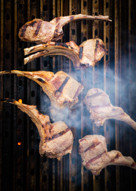istock Rack of Lamb chops on grill grates top view 1322408336