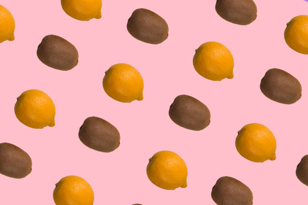 istock Lemons and kiwis multiplied on trendy soft pink background 1322413357