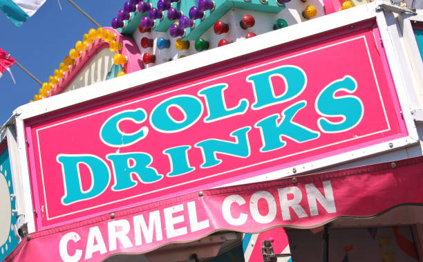 istock Pink Food Vendor Sign at County Fair Cold Drinks and Carmel Corn 1322416587