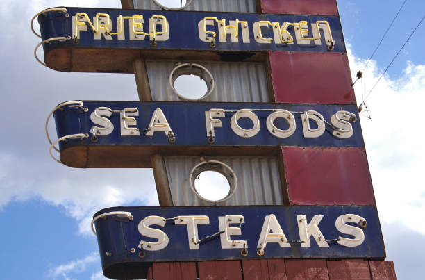 istock Restaurant Sign Outdoors On Building Roof With Blue Sky 1322416604
