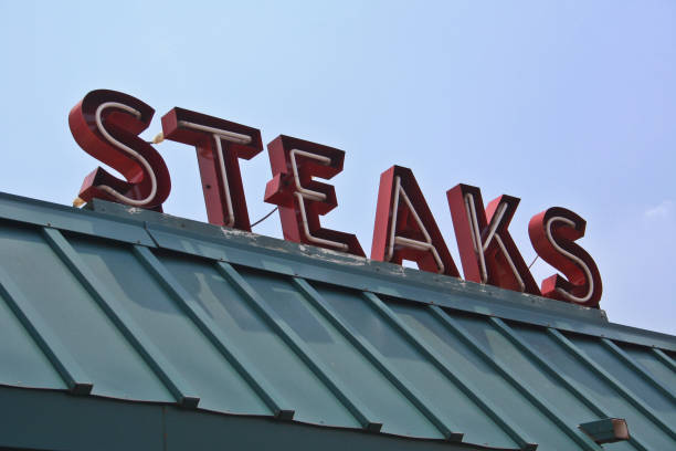istock Restaurant Sign Outdoors On Building Roof With Blue Sky 1322416637
