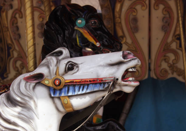 istock Vintage Carousel horses at rural carnival or fair 1322417283