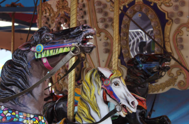 istock Vintage Carousel horses at rural carnival or fair 1322417500