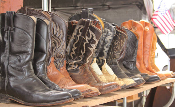 istock Old Boots For Sale with American Flag. Shallow DOF 1322417583