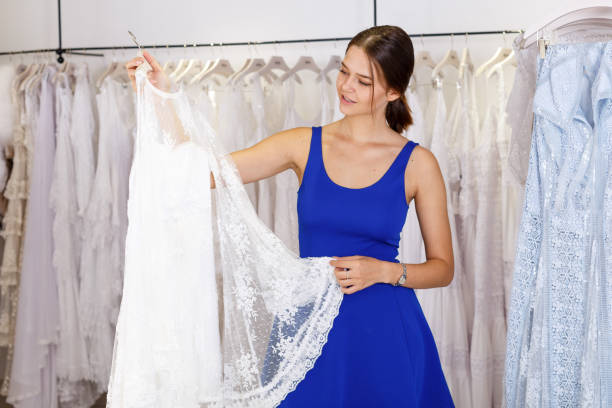 istock Girl choosing wedding dress 1322418475