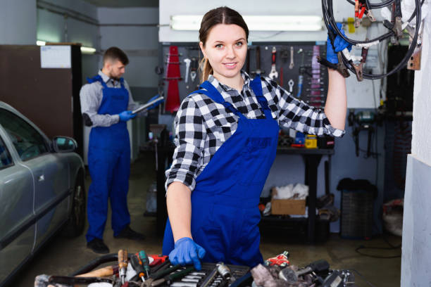 istock Young woman master is posing on her workplace in workshop. 1322418512