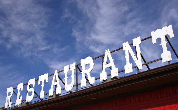 istock Restaurant Sign Outdoors On Building Roof With Blue Sky 1322423412