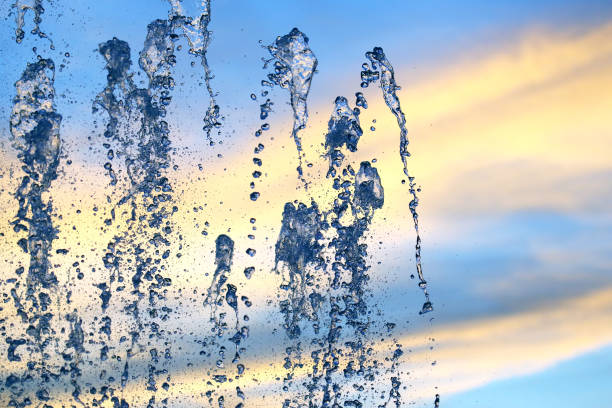 istock drops of the fountain in the setting sun 1322427675