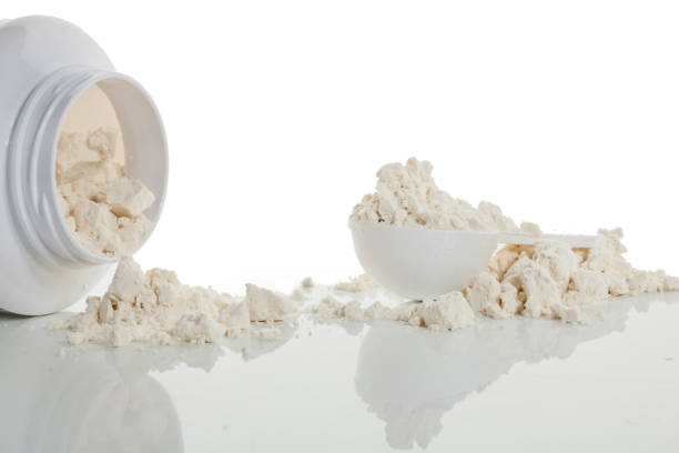 istock Container of protein powder on a white background. 1322429215