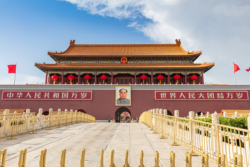 BEIJING - May 8, 2021: A portrait of Chairman Mao and armed police on the gate tower at Tiananmen Square. The celebration of the 100th anniversary of the founding of the Party will be held soon.