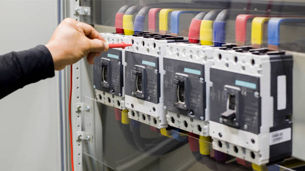 istock Electrical engineer tests the operation of the electric control cabinet on a regular basis for maintenance. 1322432279