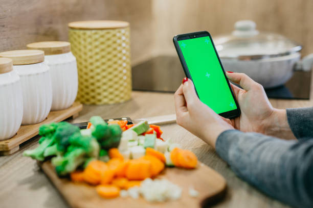 istock Reading a recipe from a smartphone 1322433853