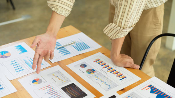 istock Businessperson explaining on business paperwork on office desk 1322443274