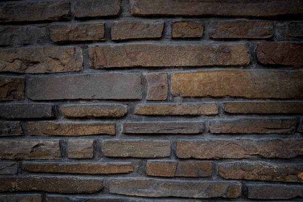 istock Texture of a stone wall. Old stone wall texture background. Stone wall as a background or texture. Part of a stone wall, for background or texture. 1322443336