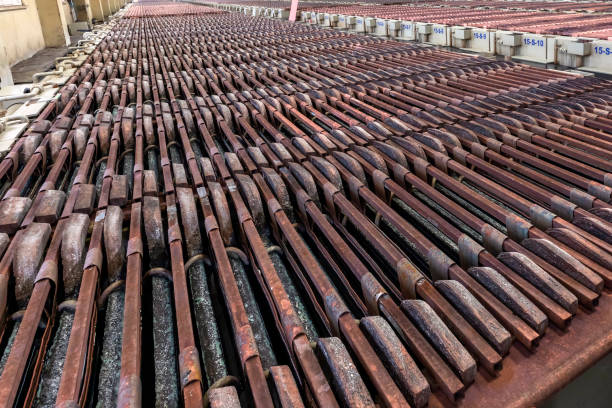 istock Electrolysis of copper anodes and cathodes. Copper is refined by electrolysis. The anodes cast from processed blister copper are placed into an aqueous solution of copper sulfate and sulfuric acid. 1322443959