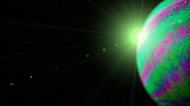 istock Vibrant universe. Abstract galaxy background with globe planet earth in universe space with sunlight on dark background. Macro of oil mixed with water. 1322444363