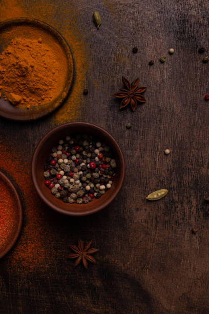 istock Pepper and other spices on a brown background 1322445362