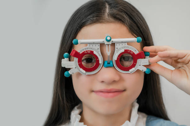 A young girl examines her eyesight at an ophthalmologist's appointment.
The patient is examined by an ophthalmologist. stock photo