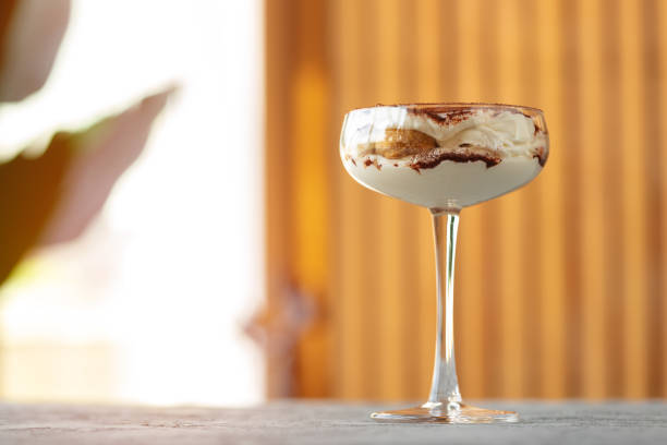 istock Tiramisu dessert in a glass on gray surface 1322445548