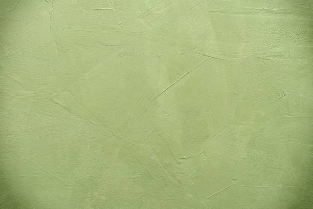 Olive color stucco background. Textured grunge backdrop.