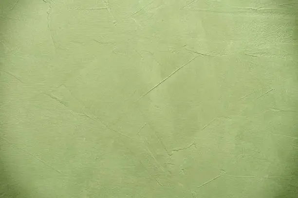 Olive color stucco background. Textured grunge backdrop
