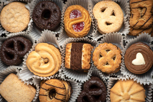 istock Various sweet tea cookies in a box on a wooden table top view 1322449980