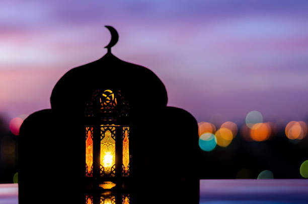 istock Lantern with blurred focus of mosque background 1322451046