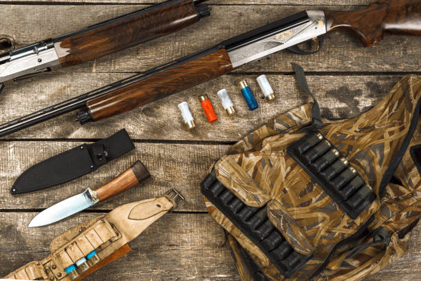 istock Hunting equipment on old dark wooden background 1322451908