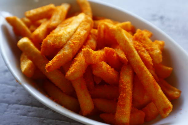 istock Freshly cooked cheese flavored French fries 1322454657