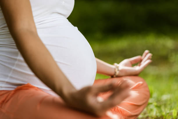 istock Pregnant woman doing yoga 1322455944