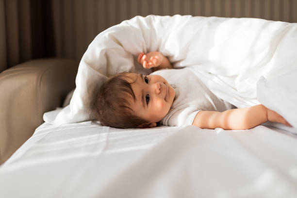 istock Beautiful baby on the bed 1322456982