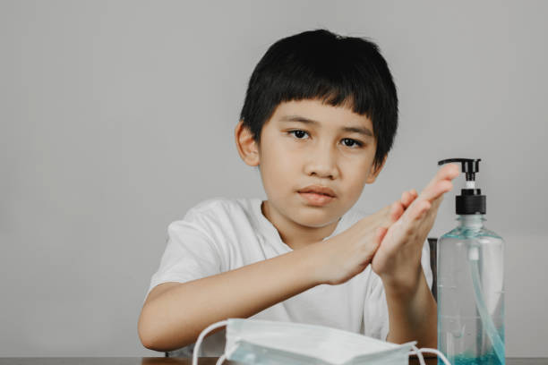 istock Cleaning hands with alcohol gel 1322457235