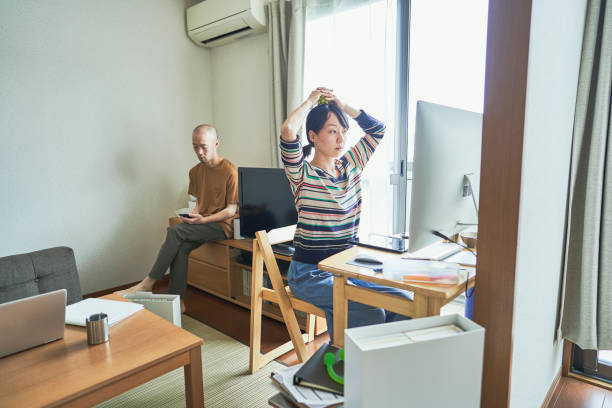 istock Asian couple working together at home. 1322458736