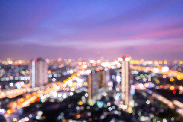 istock Bokeh light and blur modern city skyline sunrise background. 1322459004