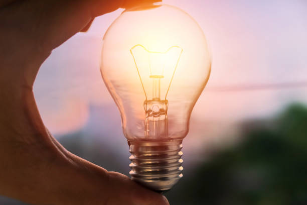 istock Hand holding light bulb. idea concept with innovation and inspiration for good idea 1322459618