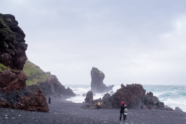 istock Black stone beach in Iceland 1322461024