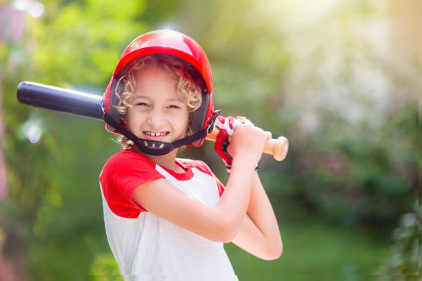 istock Kids play baseball. Child with bat and ball. 1322461109