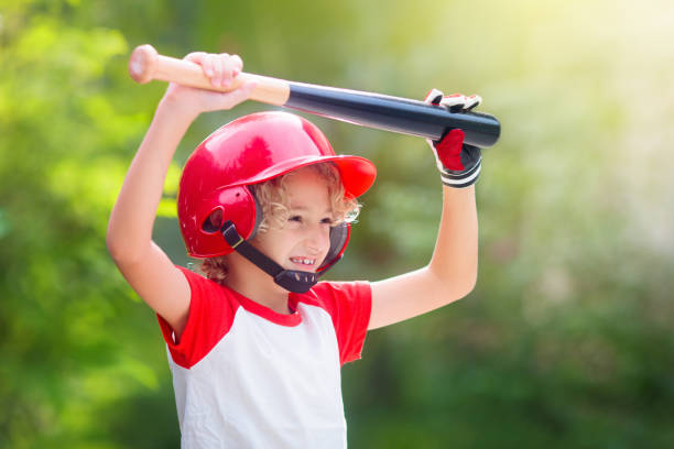 istock Kids play baseball. Child with bat and ball. 1322461167