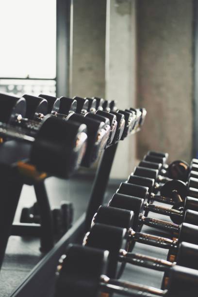 istock Dumbells in the gym center 1322461327