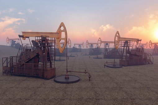 Oil Well With Drilling Rigs And Pumpjacks